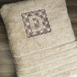 Serviette de toilette avec broderie embossée